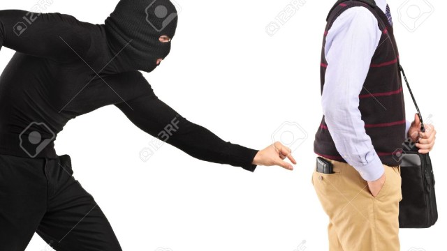 14549662-Pickpocket-trying-to-steal-a-wallet-Stock-Photo-stealing-money-pickpocket